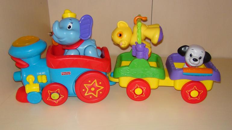 Паровозик чух чух чух белые. Паровоз Чух-Чух Fisher Price. Паровозик Чух Чух игрушка. Паровозик цирковой Fisher Price. Паровозик Fisher-Price с животными.